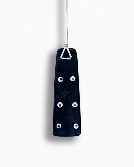 Amulet with White Beads in Bronze