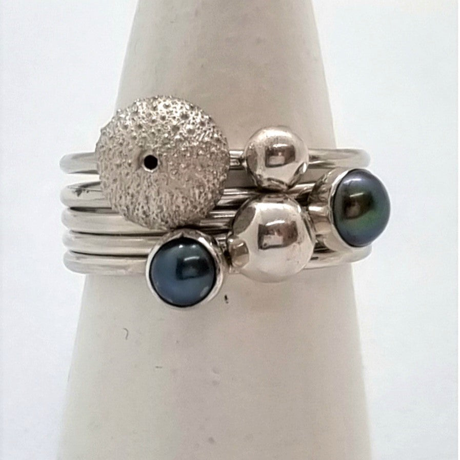 Kina with Dark Fresh Water Pearl Rings
